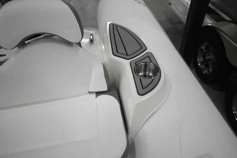 Slide: The Image of 2025 Zodiac Yachtline 490 Deluxe NEO, white seating with cup holder detail. - 19