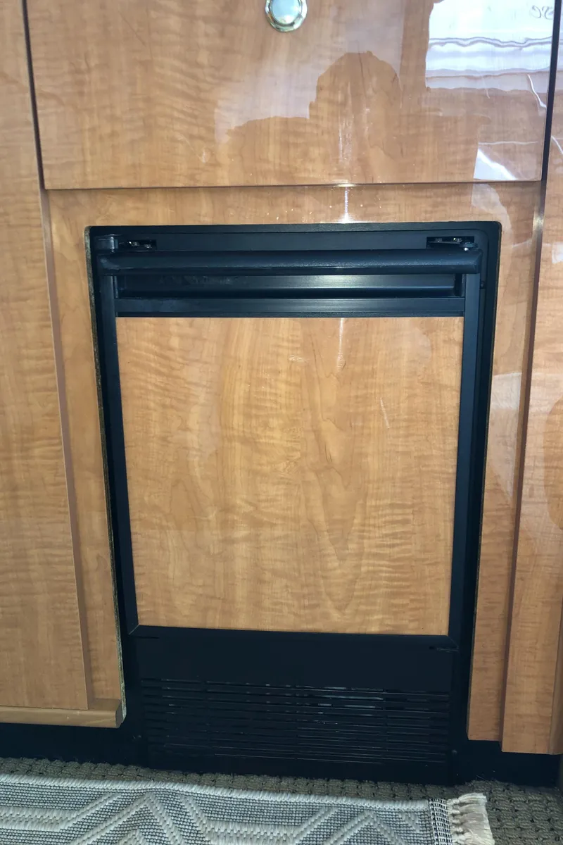 Slide: The Image of Wood-paneled appliance in 2002 Bayliner 5288 PILOTHOUSE yacht interior. - 12