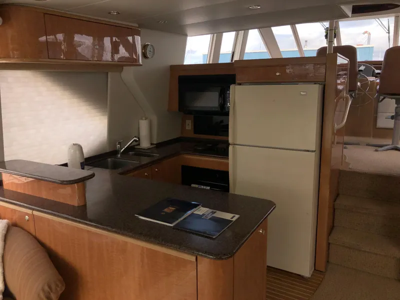 Slide: The Image of Luxurious kitchen interior of 2002 Bayliner 5288 PILOTHOUSE yacht with modern amenities. - 18