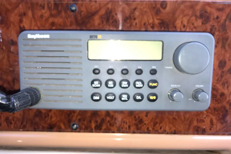 Slide: The Image of Control panel of a 2002 Bayliner 5288 PILOTHOUSE boat with radio and buttons. - 23