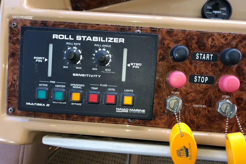 Slide: The Image of Control panel of a 2002 Bayliner 5288 PILOTHOUSE with roll stabilizer and ignition keys. - 24