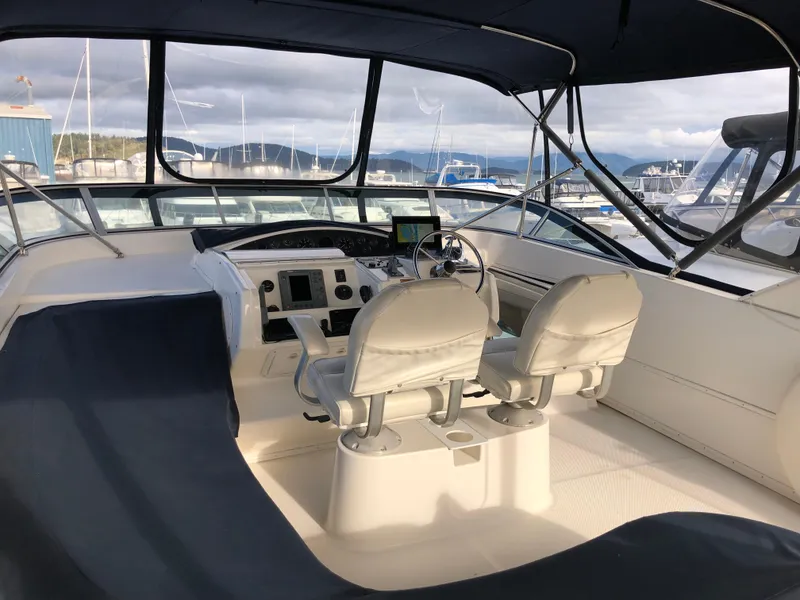 Slide: The Image of 2002 Bayliner 5288 PILOTHOUSE interior with dual helm seats and navigation equipment. - 28