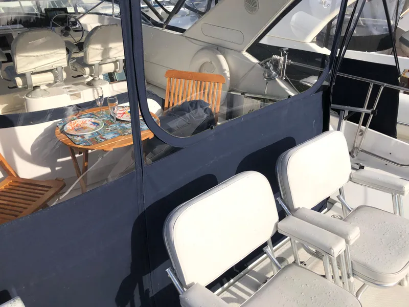 Slide: The Image of 2002 Bayliner 5288 Pilothouse yacht interior with seating and dining area. - 29