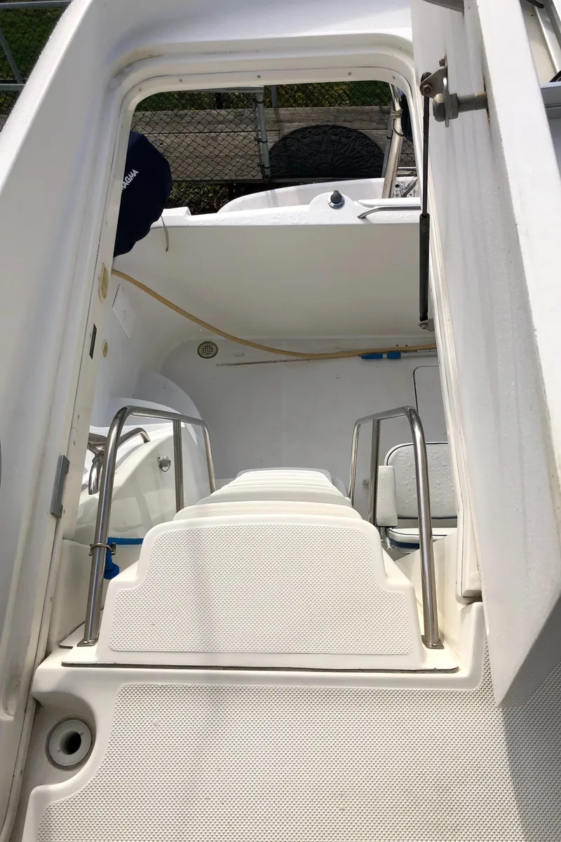 Slide: The Image of 2002 Bayliner 5288 PILOTHOUSE boat interior with white steps and railing. - 31