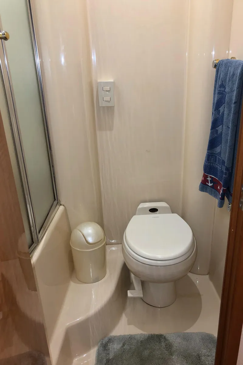 Slide: The Image of 2002 Bayliner 5288 PILOTHOUSE bathroom with toilet, shower, and towel. - 35