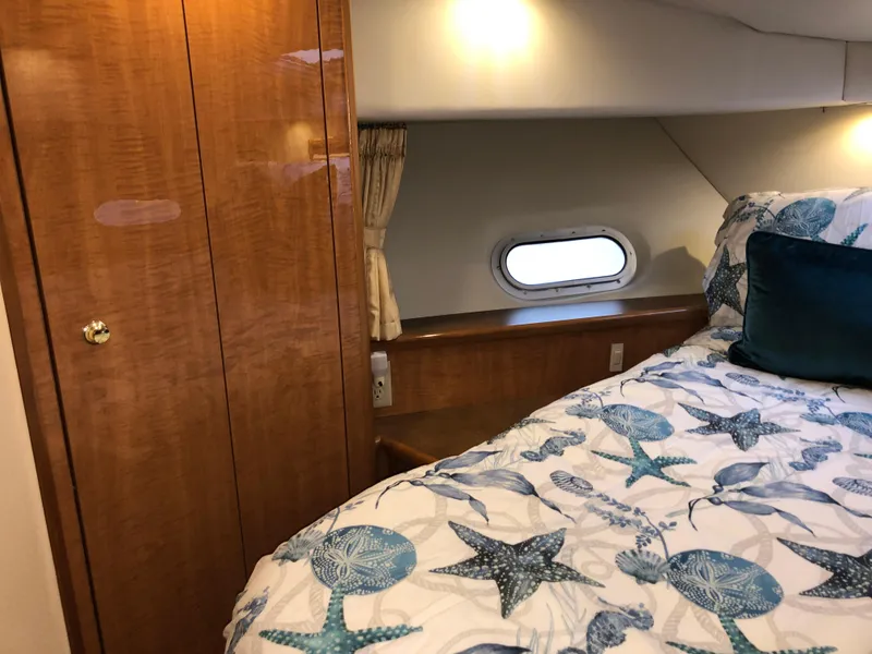 Slide: The Image of Luxurious cabin interior of 2002 Bayliner 5288 PILOTHOUSE with nautical-themed bedding. - 42