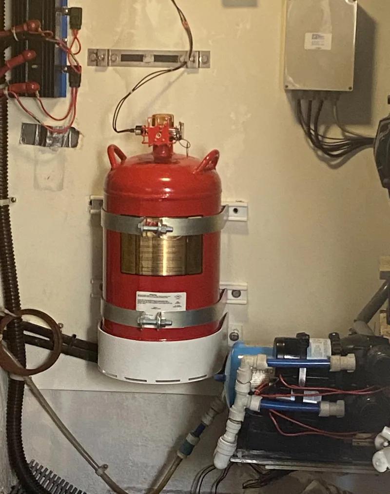 Slide: The Image of Engine room of 2002 Bayliner 5288 PILOTHOUSE with fire suppression system. - 49