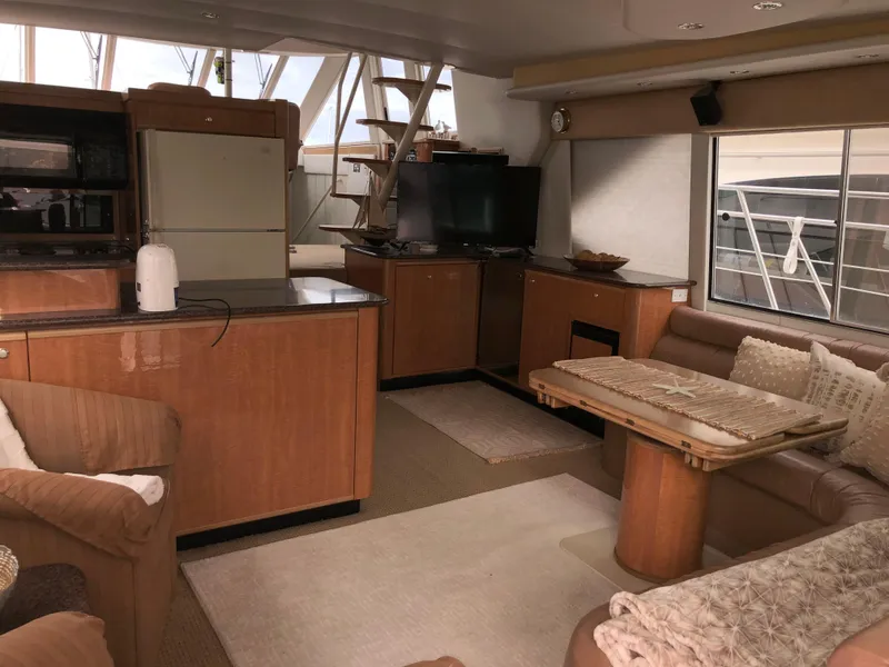 Slide: The Image of Interior of 2002 Bayliner 5288 PILOTHOUSE yacht with modern furnishings and kitchen area. - 8