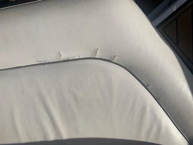 Slide: The Image of Torn upholstery on 2007 Crownline 230 LS boat seat. - 10