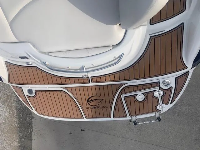 Slide: The Image of Crownline 230 LS 2007 boat deck with wood finish and logo. - 14