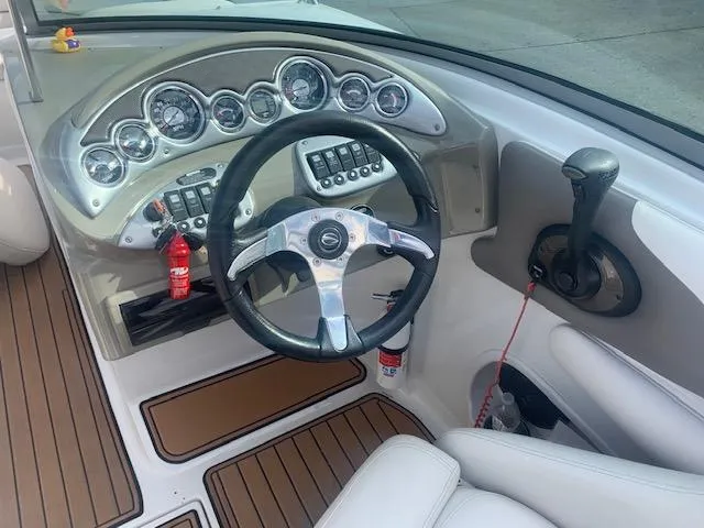 Slide: The Image of 2007 Crownline 230 LS boat dashboard with steering wheel and gauges. - 17