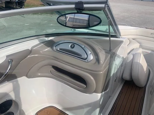 Slide: The Image of 2007 Crownline 230 LS boat interior with sleek dashboard and comfortable seating. - 19