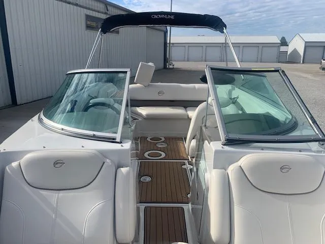 Slide: The Image of 2007 Crownline 230 LS boat with white interior and open deck layout. - 20