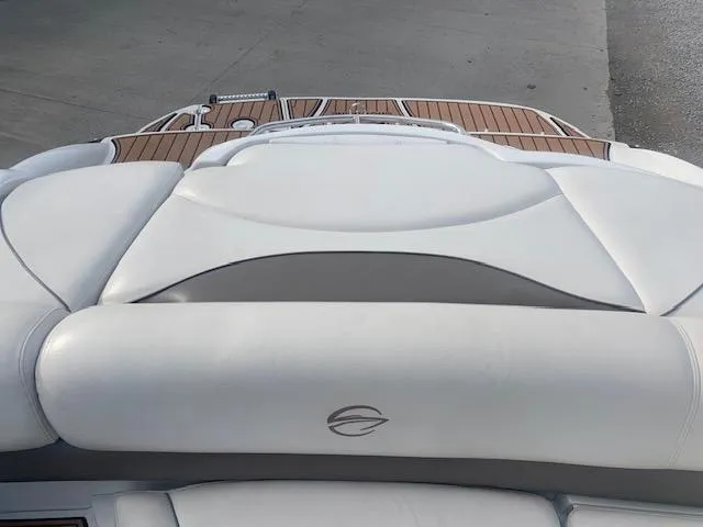 Slide: The Image of 2007 Crownline 230 LS boat with white leather seating and teak deck. - 23