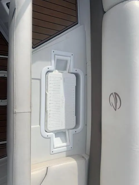 Slide: The Image of 2007 Crownline 230 LS boat interior with white seating and logo detail. - 24