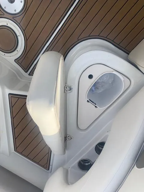 Slide: The Image of Crownline 230 LS 2007 boat interior with white seating and wood accents. - 25