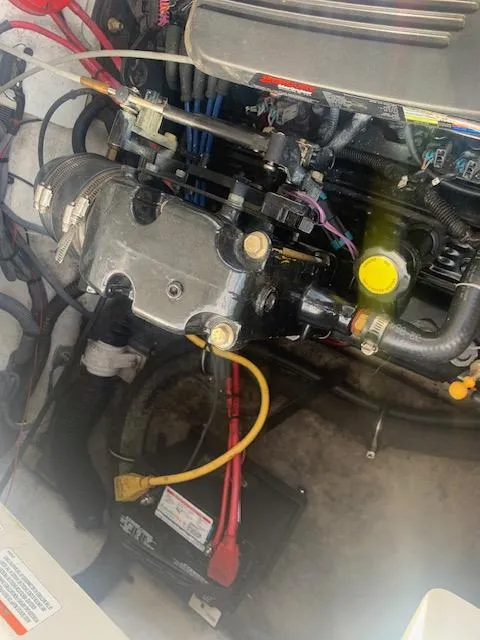 Slide: The Image of Engine compartment of a 2007 Crownline 230 LS boat, showing wiring and components. - 28