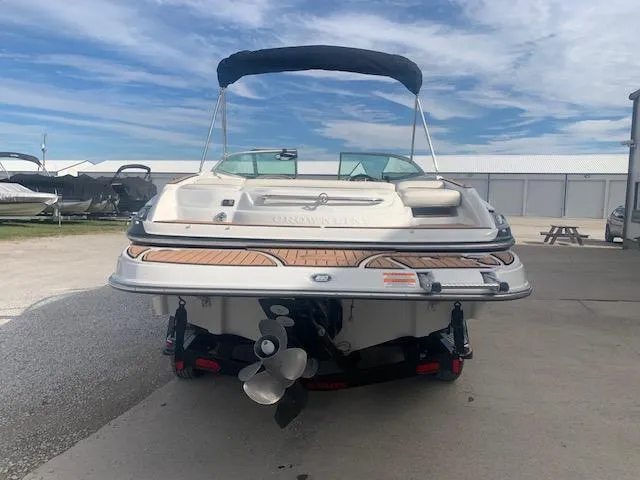 Slide: The Image of 2007 Crownline 230 LS boat, rear view, docked under a blue sky. - 32