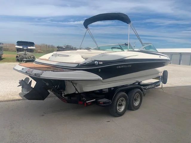 Slide: The Image of 2007 Crownline 230 LS boat on trailer, parked outdoors. - 33