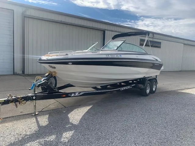 Slide: The Image of 2007 Crownline 230 LS boat on trailer, parked outside a warehouse. - 37