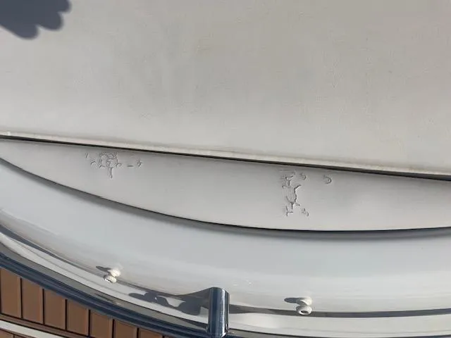 Slide: The Image of Close-up of 2007 Crownline 230 LS boat surface with minor wear. - 9
