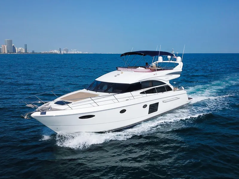 The Image of Luxurious 2013 Princess 60 yacht cruising on open blue sea. - 1