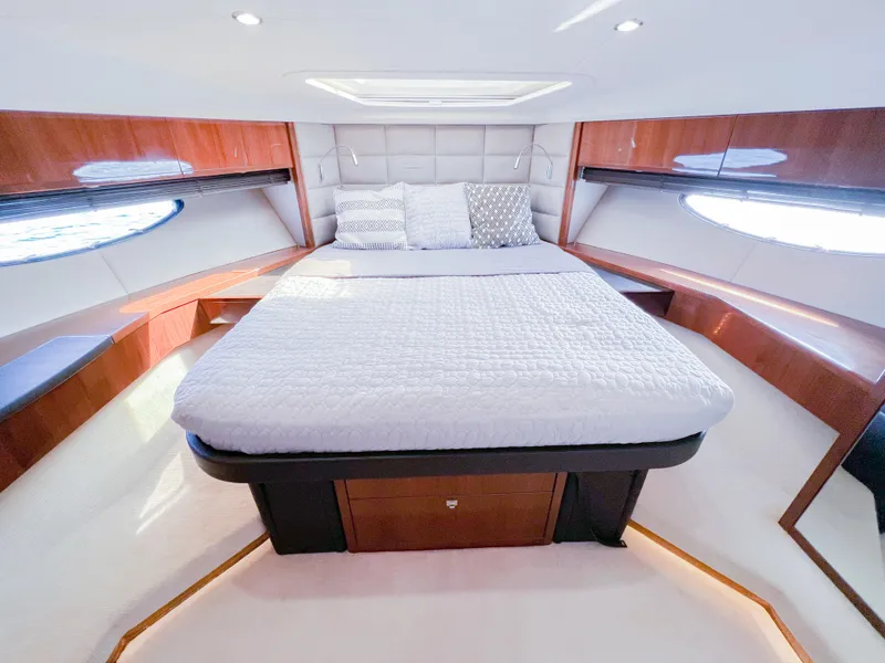 Slide: The Image of Luxurious cabin interior of 2013 Princess 60 yacht with elegant bedding and wood accents. - 14
