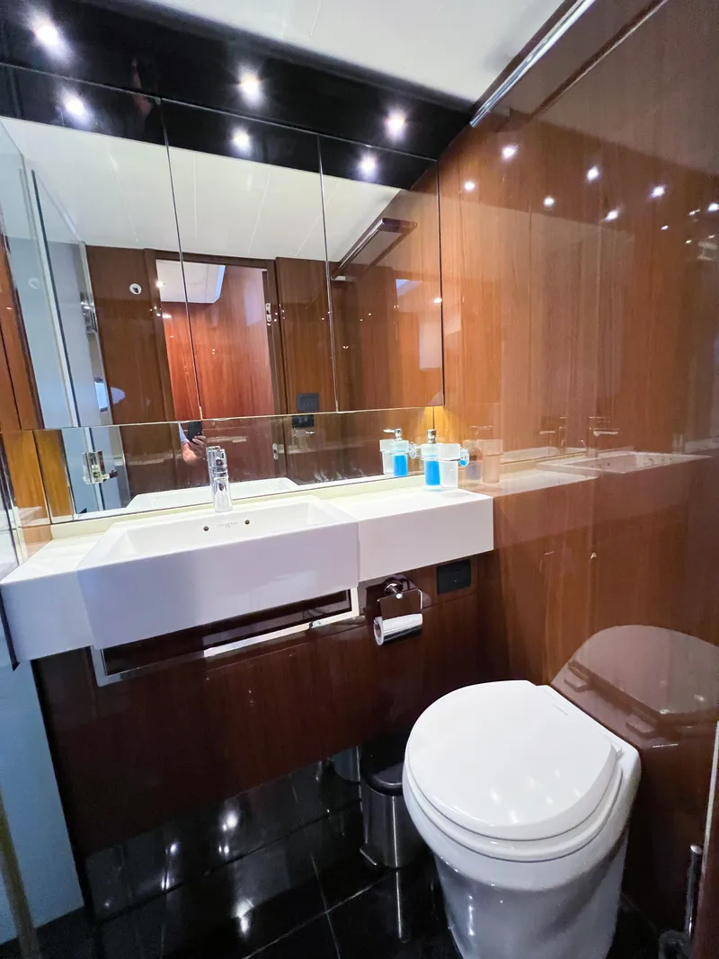 Slide: The Image of Luxurious bathroom in 2013 Princess 60 yacht with sleek wood paneling and modern fixtures. - 15