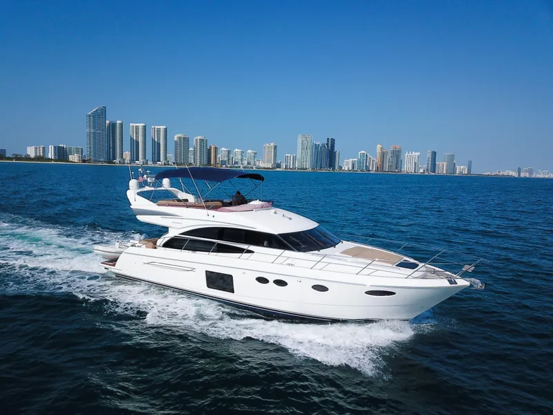 Slide: The Image of Luxurious 2013 Princess 60 yacht cruising near a city skyline on a sunny day. - 2