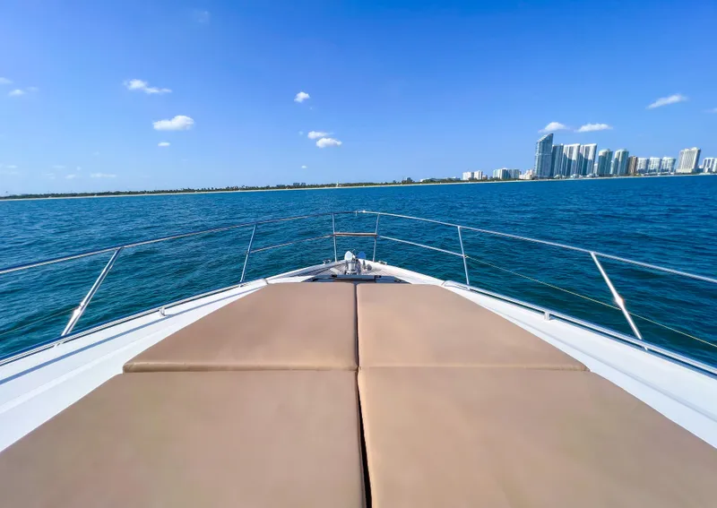 Slide: The Image of Princess 60 yacht cruising on blue ocean with city skyline in background, 2013 model. - 21