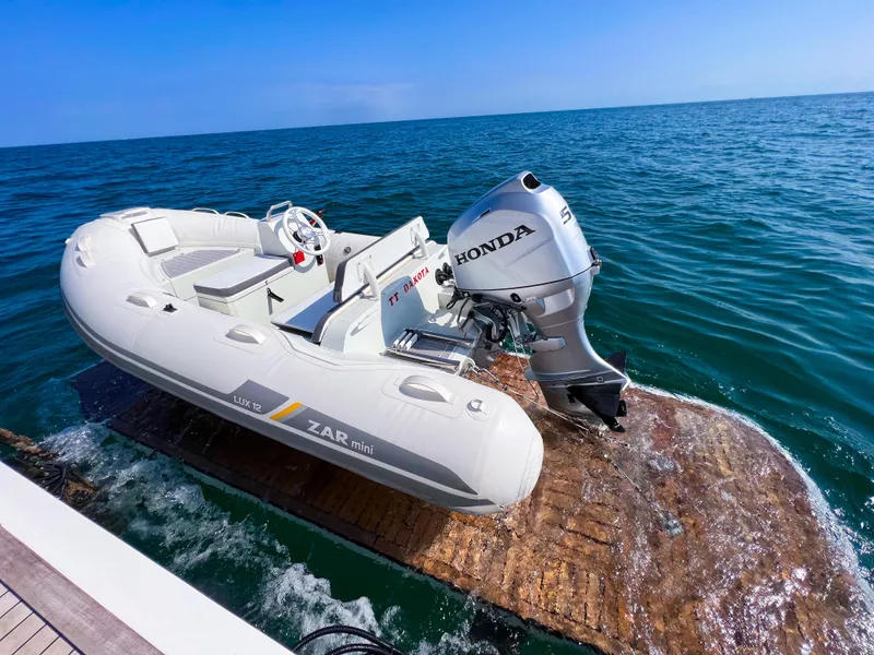 Slide: The Image of Inflatable boat with Honda motor on water, Princess 60, 2013 model. - 28