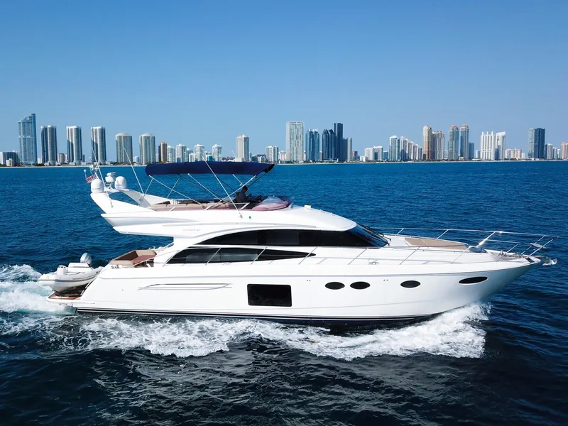 Slide: The Image of Luxurious 2013 Princess 60 yacht cruising near a city skyline on a sunny day. - 4