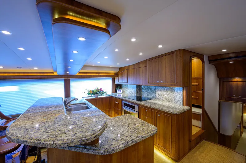 Slide: The Image of Luxurious kitchen interior of 2011 Paul Mann Custom 81 Convertible yacht with granite countertops. - 10