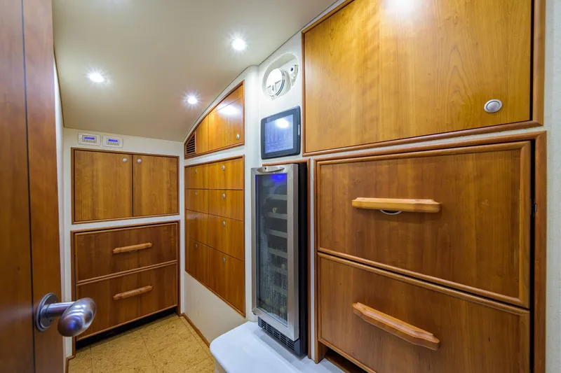 Slide: The Image of Luxurious wooden cabinetry in 2011 Paul Mann Custom 81 Convertible yacht interior. - 14