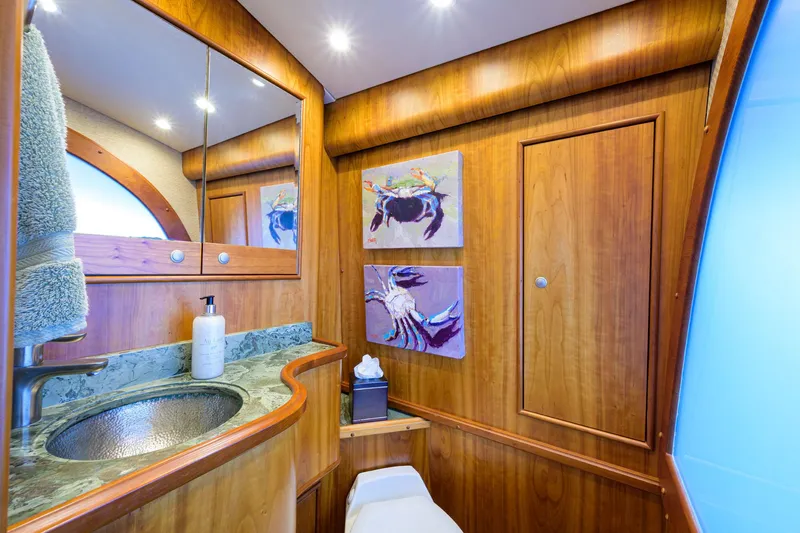 Slide: The Image of Luxurious bathroom in 2011 Paul Mann Custom 81 Convertible yacht with wood accents and modern fixtures. - 15