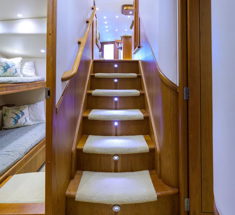 Slide: The Image of Luxurious wooden staircase with LED lights in 2011 Paul Mann Custom 81 Convertible yacht. - 16
