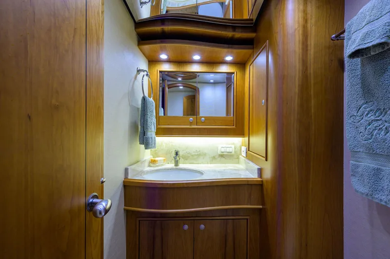 Slide: The Image of Luxurious wooden bathroom interior in 2011 Paul Mann Custom 81 Convertible yacht. - 20