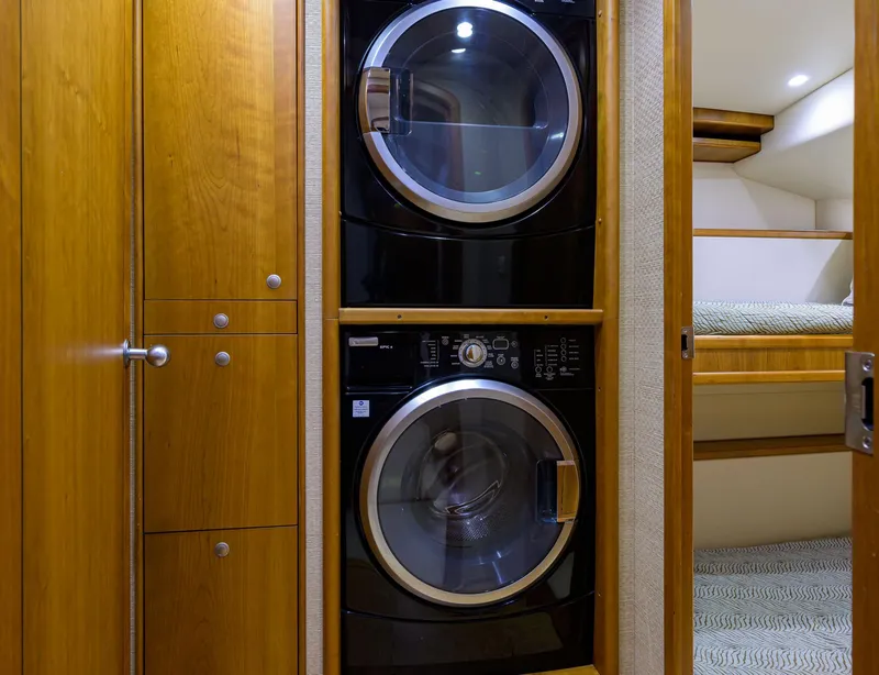 Slide: The Image of Stacked washer and dryer in 2011 Paul Mann Custom 81 Convertible yacht interior. - 22