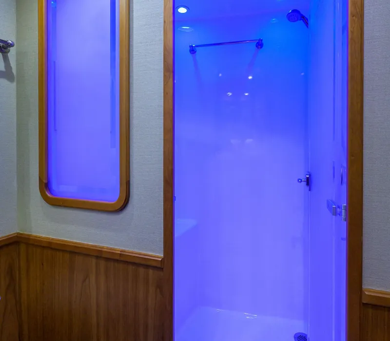 Slide: The Image of Illuminated shower area in 2011 Paul Mann Custom 81 Convertible yacht. - 28