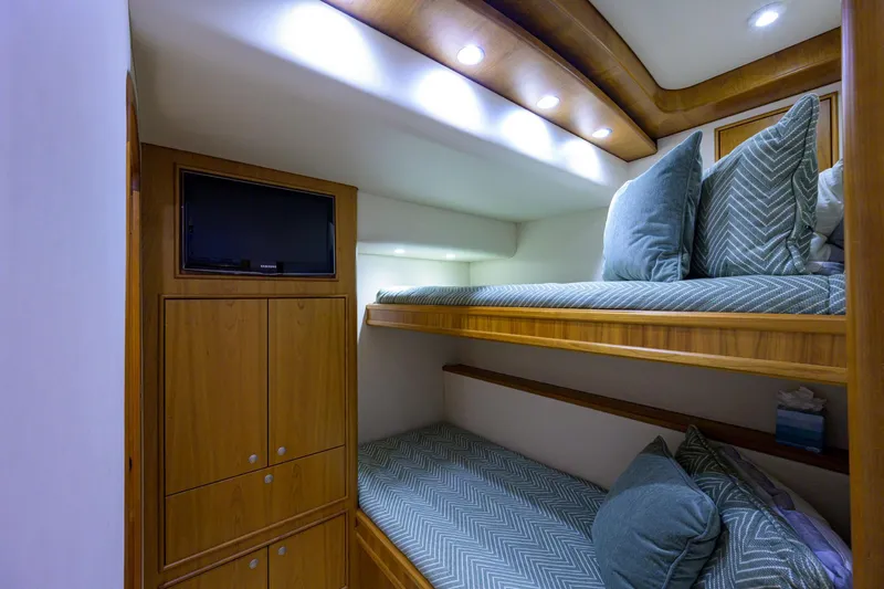 Slide: The Image of Luxurious cabin interior of 2011 Paul Mann Custom 81 Convertible yacht with bunk beds. - 31