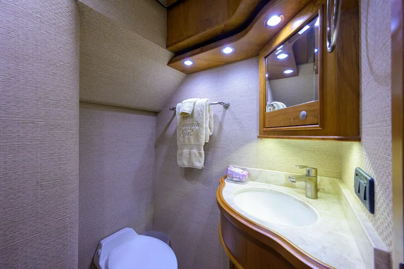 Slide: The Image of Luxurious bathroom in 2011 Paul Mann Custom 81 Convertible yacht with elegant wood accents. - 32