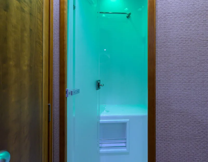 Slide: The Image of Shower area in 2011 Paul Mann Custom 81 Convertible yacht with modern lighting. - 33