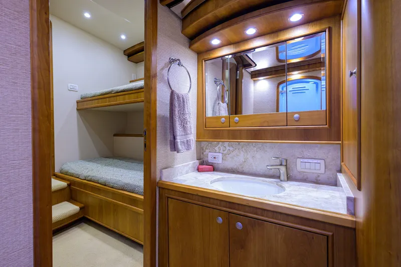 Slide: The Image of Luxurious 2011 Paul Mann Custom 81 Convertible yacht interior with bunk beds and bathroom. - 37