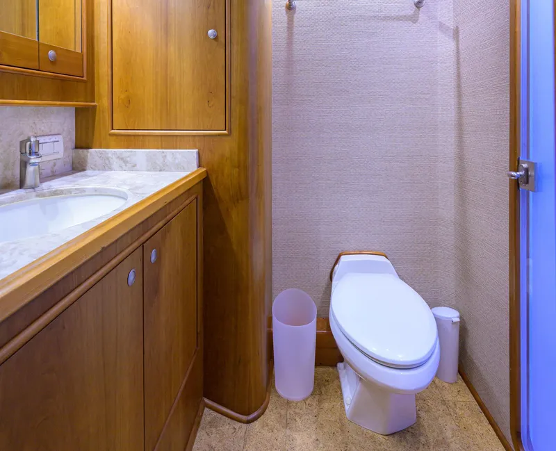 Slide: The Image of Luxurious bathroom in 2011 Paul Mann Custom 81 Convertible yacht with wooden cabinetry. - 38