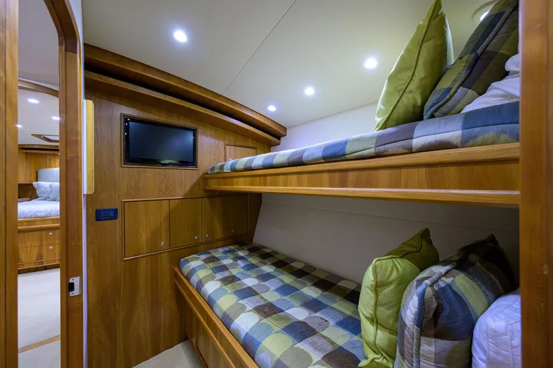 Slide: The Image of Interior of 2011 Paul Mann Custom 81 Convertible with cozy bunk beds and TV. - 40
