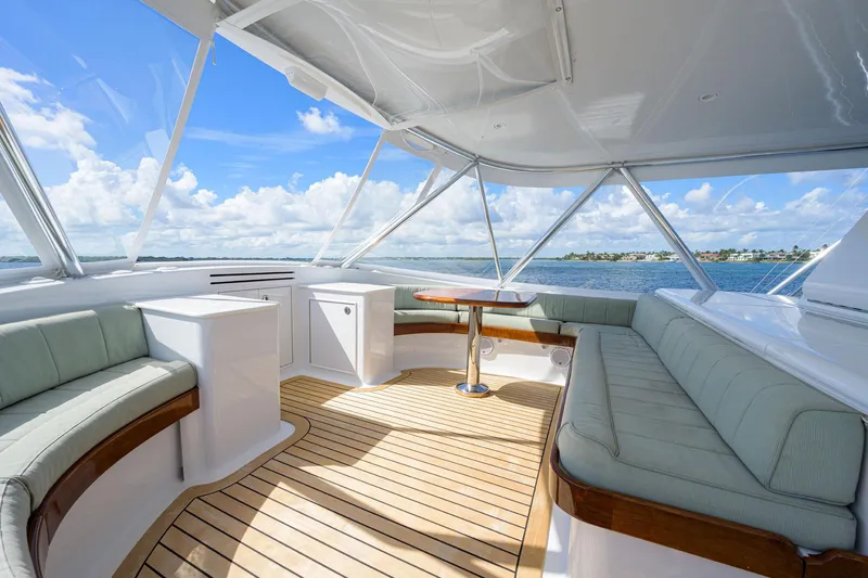 Slide: The Image of Luxurious 2011 Paul Mann Custom 81 Convertible yacht interior with elegant seating and ocean view. - 49