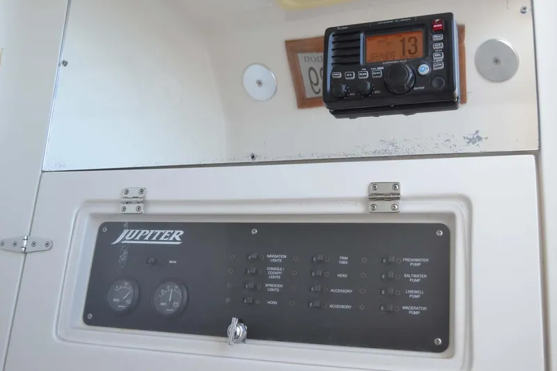 Slide: The Image of Control panel of 2012 Jupiter 34 FS boat with radio equipment. - 14