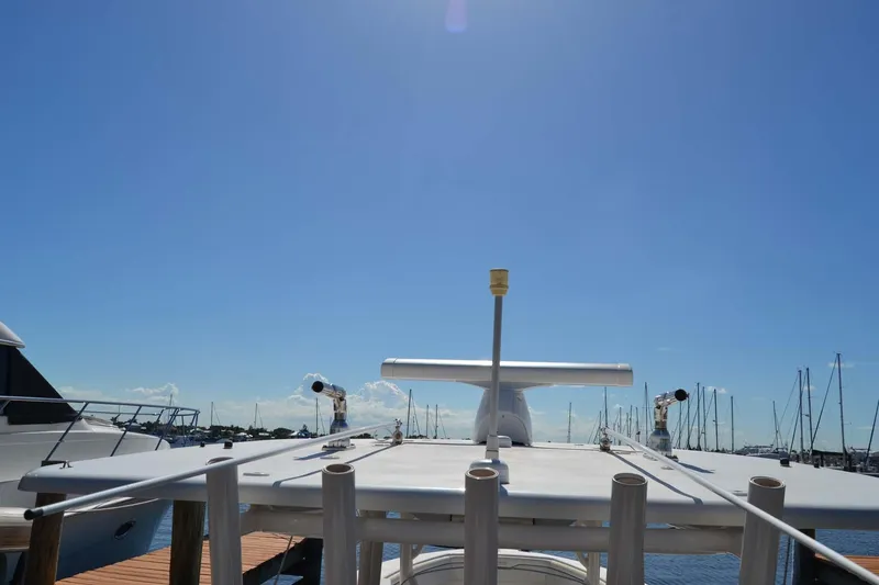 Slide: The Image of 2012 Jupiter 34 FS boat docked under clear blue sky. - 15
