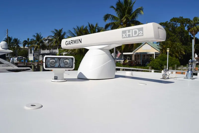 Slide: The Image of Garmin xHD2 radar on 2012 Jupiter 34 FS boat, sunny day, palm trees in background. - 16
