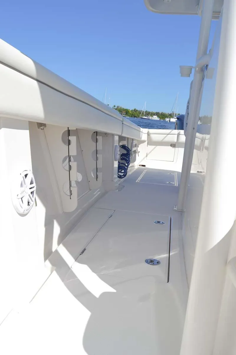 Slide: The Image of 2012 Jupiter 34 FS boat deck with clear blue sky background. - 25